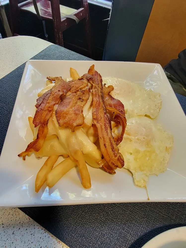 Eggs over Easy Cheese Fries and Bacon